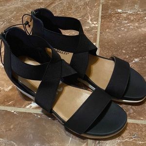 Black and brown wedges by Seychelles in a size 8 1/2 in women’s.
